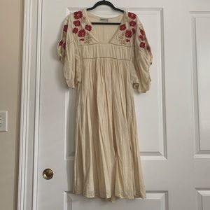 St. Roche kaftan puff sleeve midi length dress with embroidered poppies.